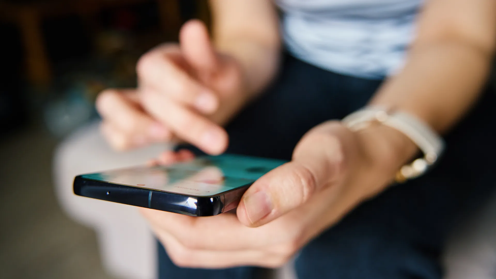 Close up of a woman scrolling on social media